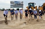 Lemoore Elementary School District officials, including board members, break ground Friday afternoon to officially begin building Freedom Elementary School, slated to open in August, 2021.
